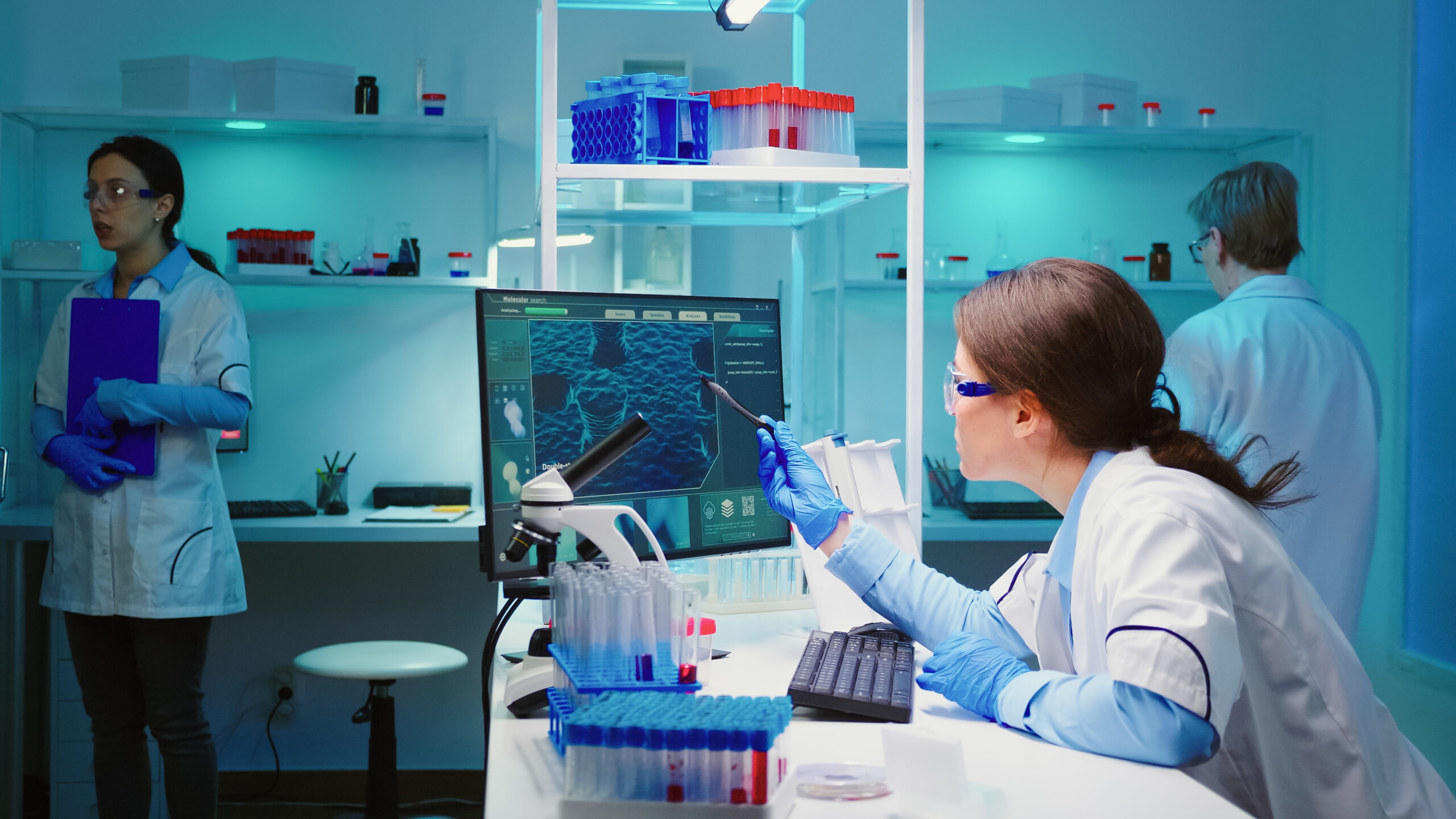 Woman biochemist checking manifestations of virus